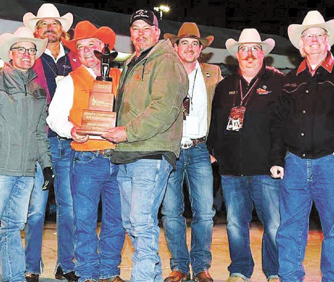 Sean Leschber (middle), Twisted L headmaster, celebrates winning overall grand champion in the 2022 World’s Championship Bar-B-Que Contest at the Houston Livestsock Show and Rodeo Feb. 26 alongside HSLSR officials.