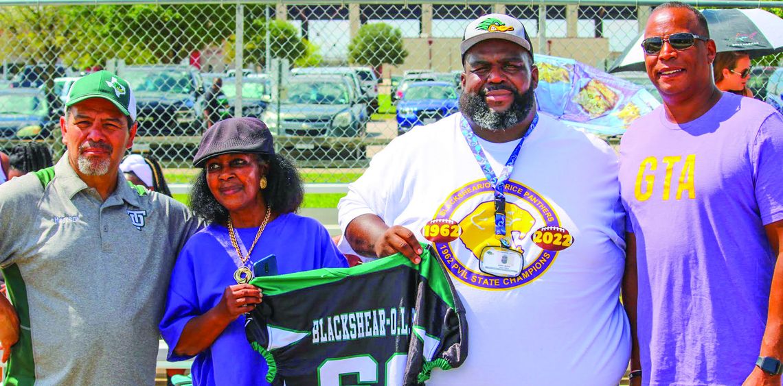 The Youth Ducks organization presented Jennifer Harris (second from left), president of the Blackshear/O.L. Price High School Ex-Students Association, with an official jersey honoring Blackshear/O.L. Price High School. At the presentation were (from left) Fernando Herrera, Youth Ducks pres...