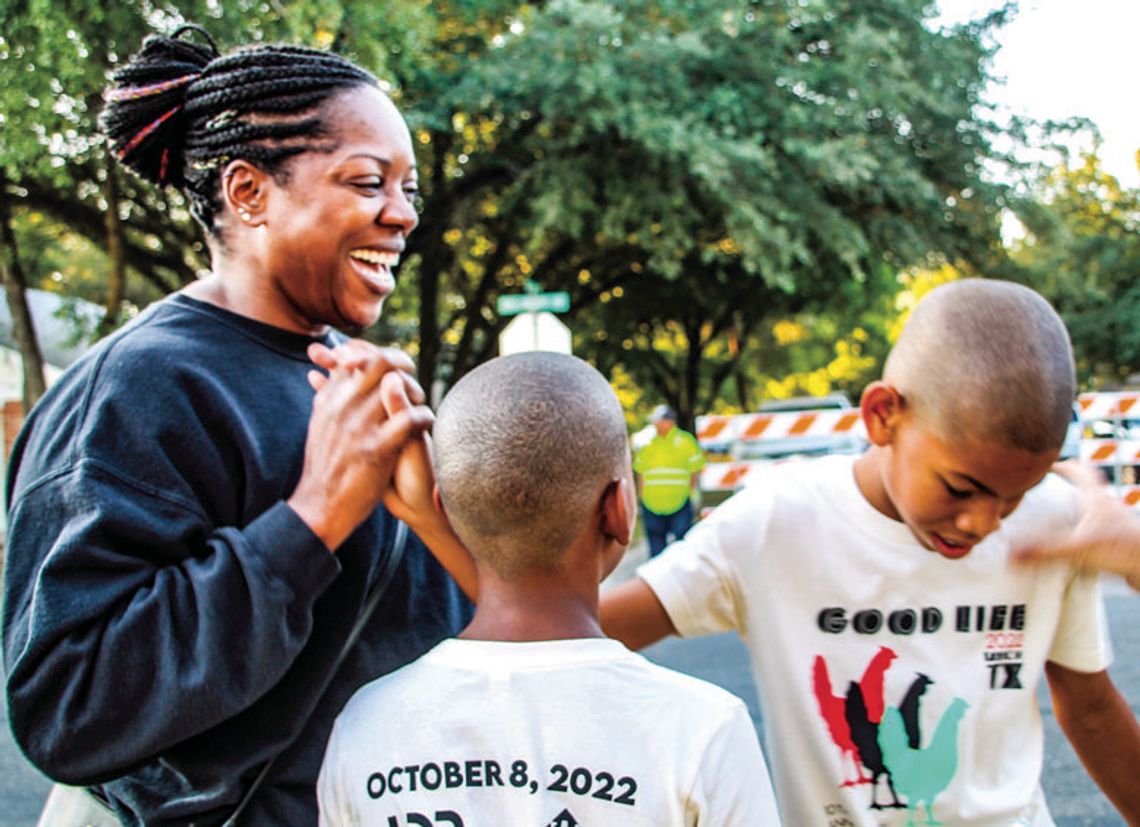 Catherine Rochez congratulates sons Arjae Rochez, 12, and Ruben Rochez, 10, Oct. 8 after the race at Bull Branch Park. Photo by Nicole Lessin