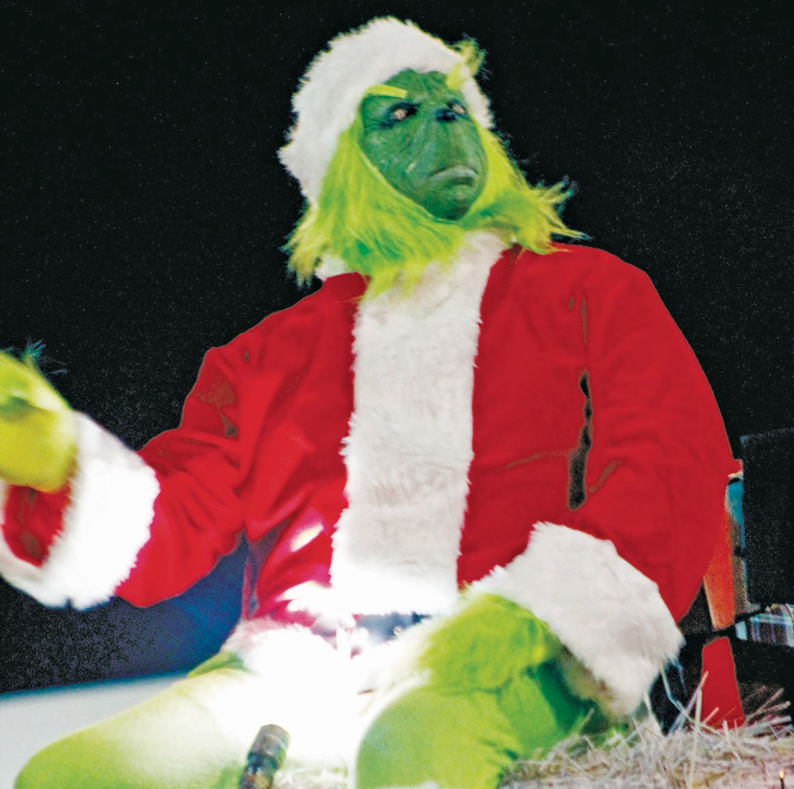 The Grinch rides in a float in the 2021 Taylor Christmas Parade of Lights. Photo by Fernando Castro