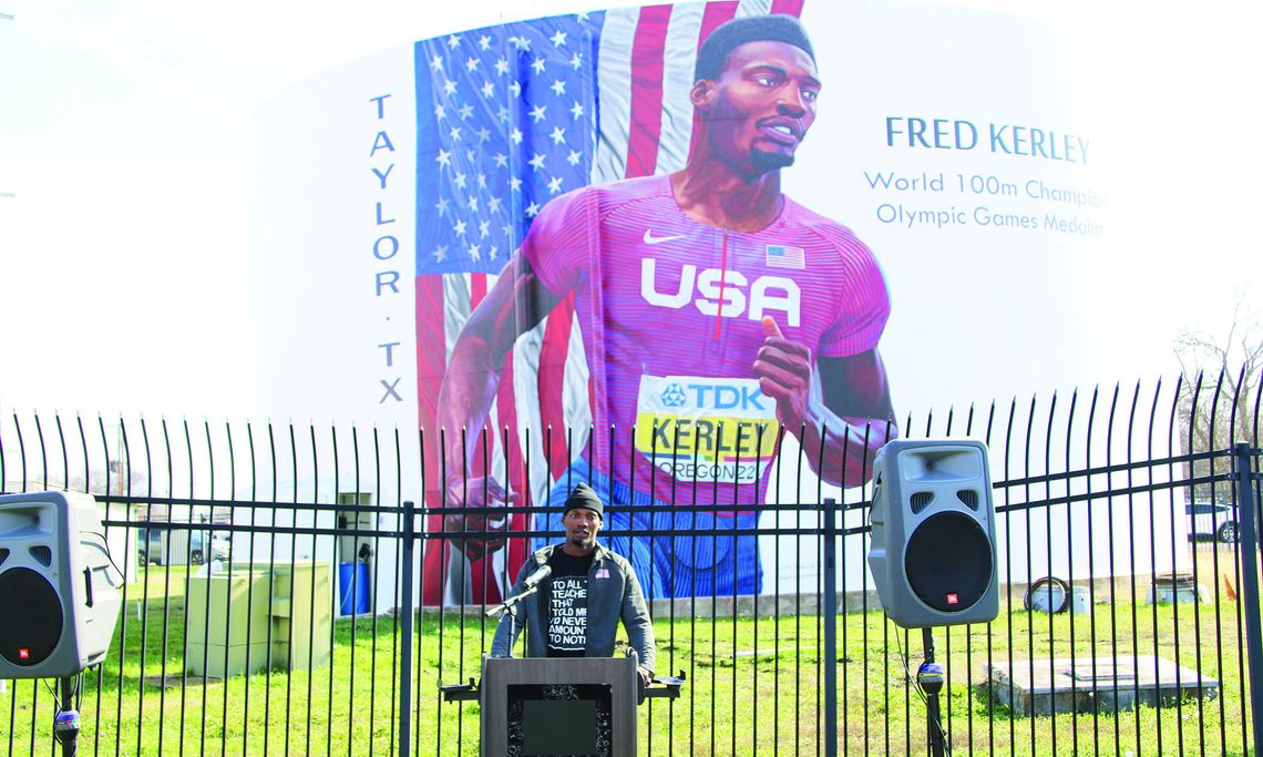 Fred Kerley thanks the Taylor community for its support of him and his family at the mural dedication Saturday morning. Photo by Jason Hennington