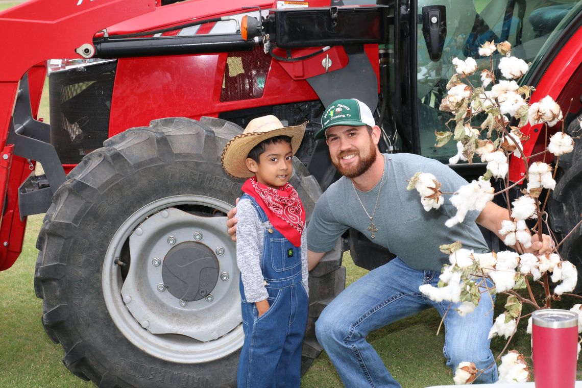 Future farmer, Andres Gonzales Huerta, visits with Taylor farmer, Tyler Jaecks, about growing corn and cotton. Photo by Tim Crow