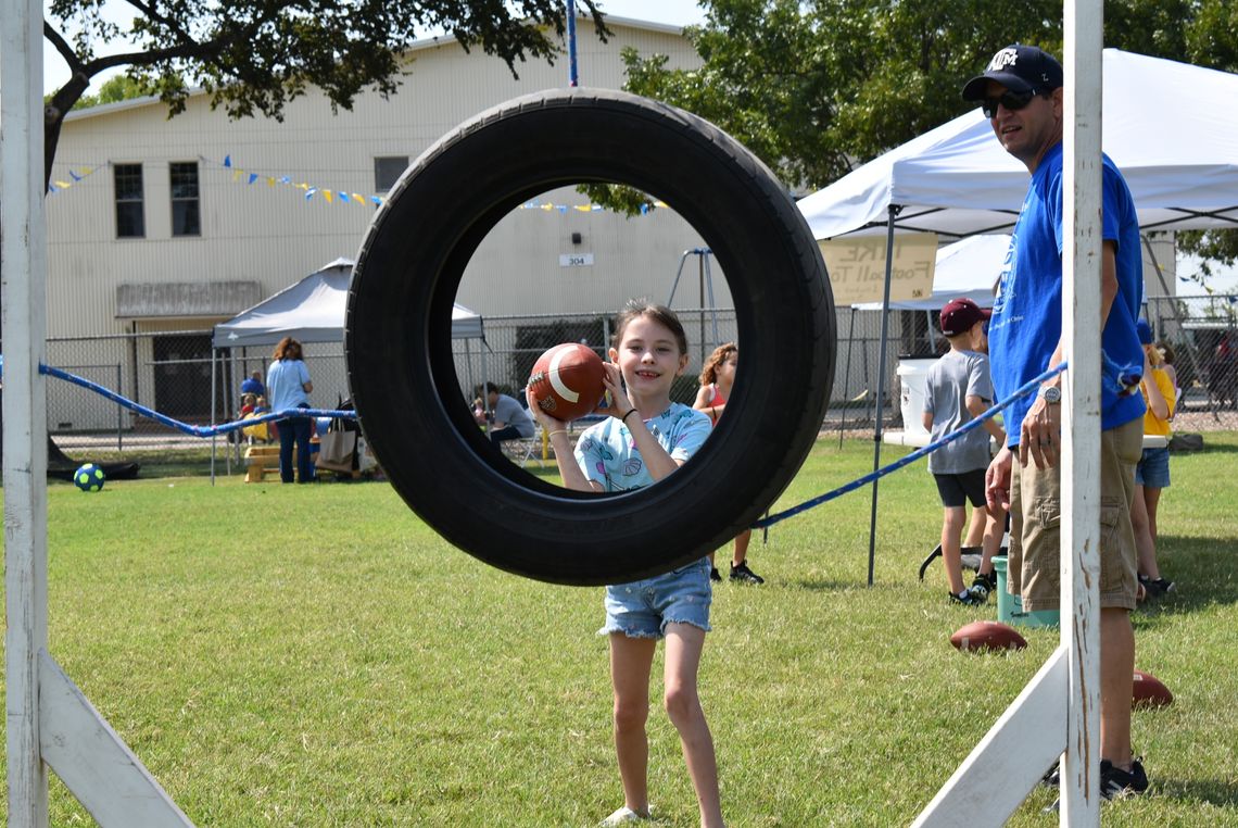 Students put their arm to the test with the quarterback challenge booth at the St. Mary’s Fall Festival Homecoming. Photos courtesy of St. Mary’s Catholic School