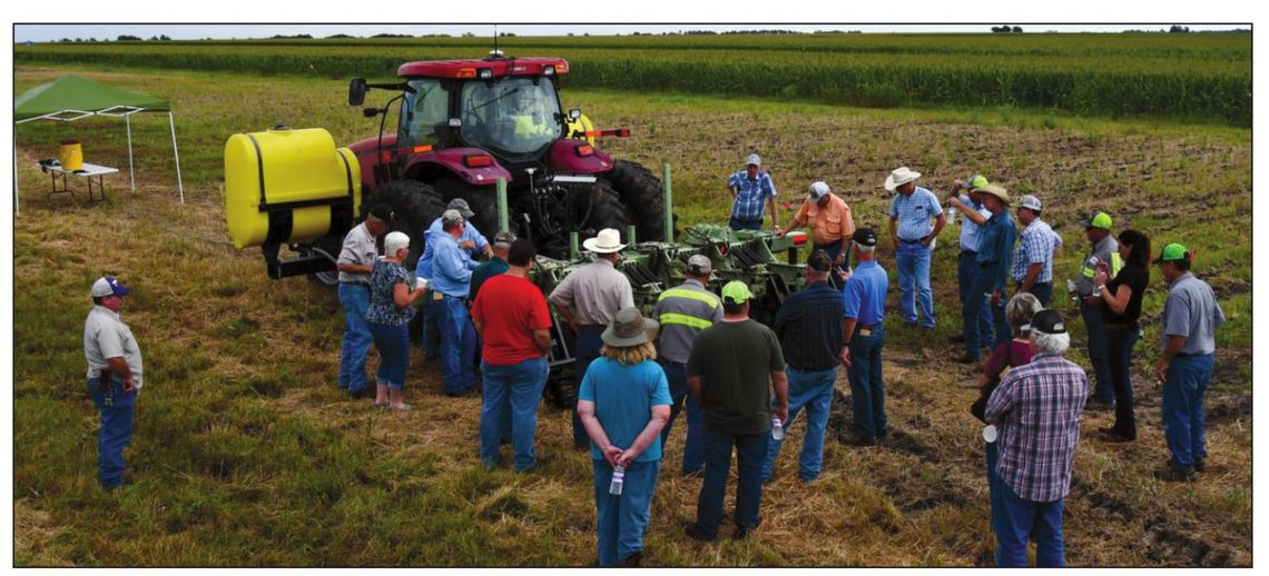 Farmers discuss Stiles Farm Field Day topics during a previous event. Texas A&amp;M AgirlLife / Blair Fannin