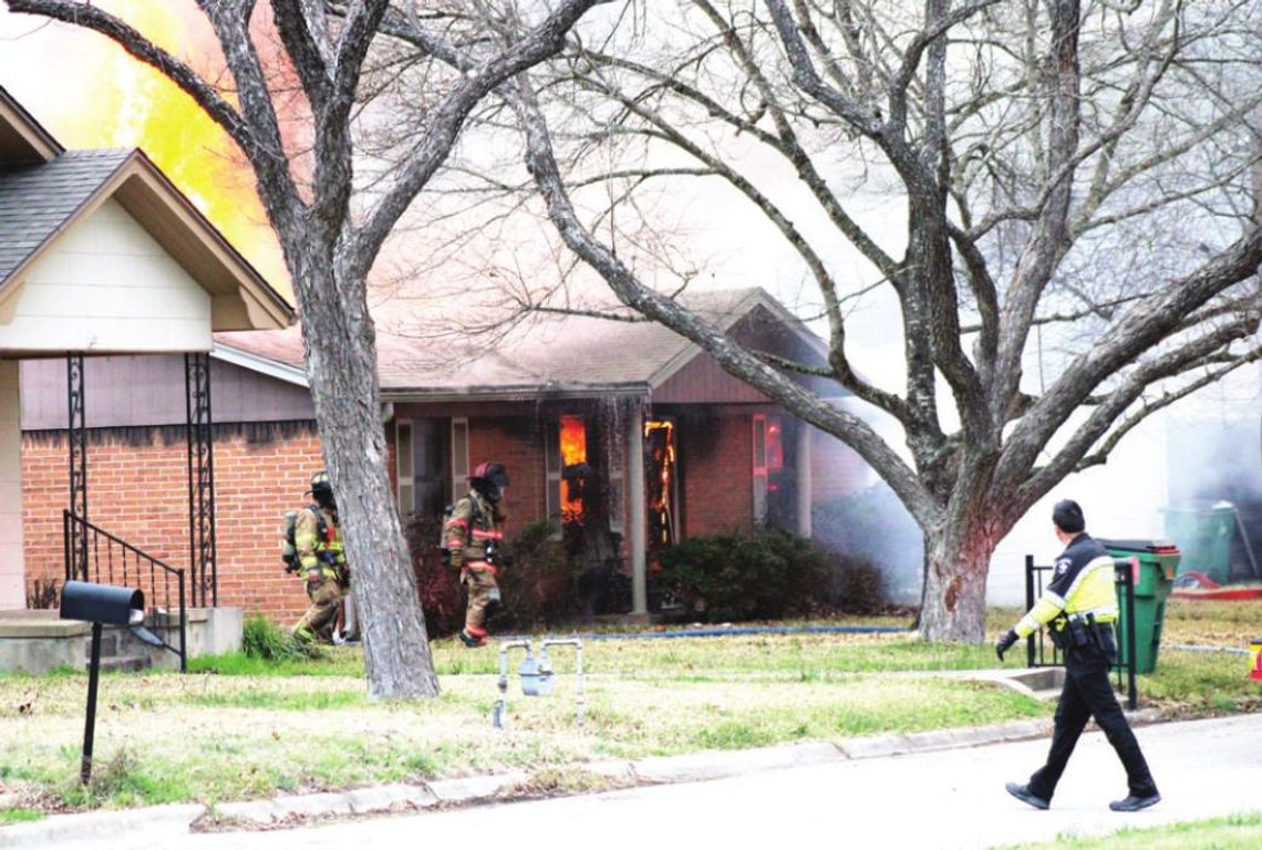 Firefighters battle a blaze in the 900 block of James Street in Taylor March 8. Photo by Matt Hooks