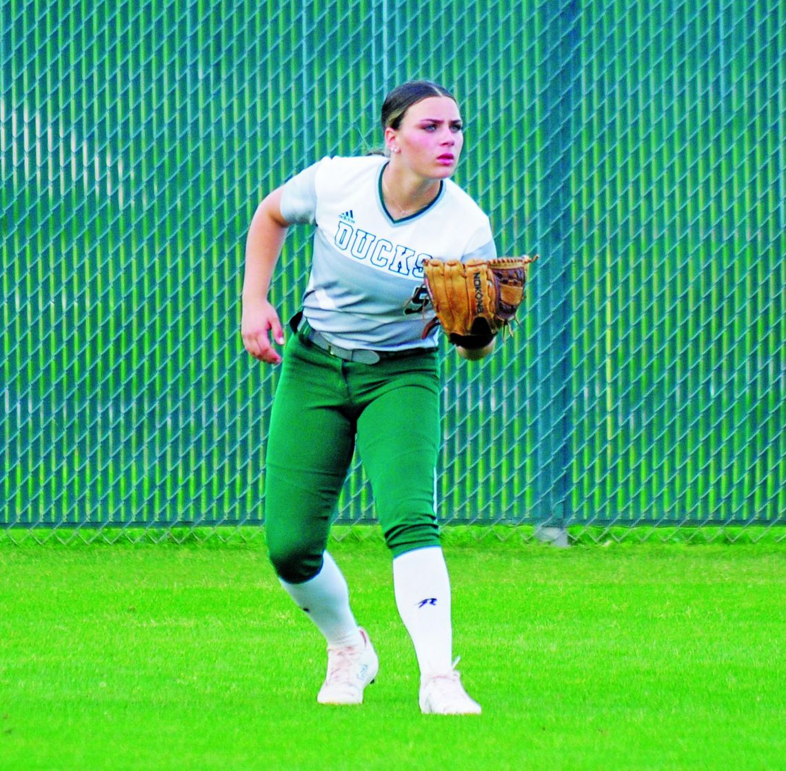 Camryn Nunamaker running to get under a ball to secure an out. Photo by Larry Pelchat