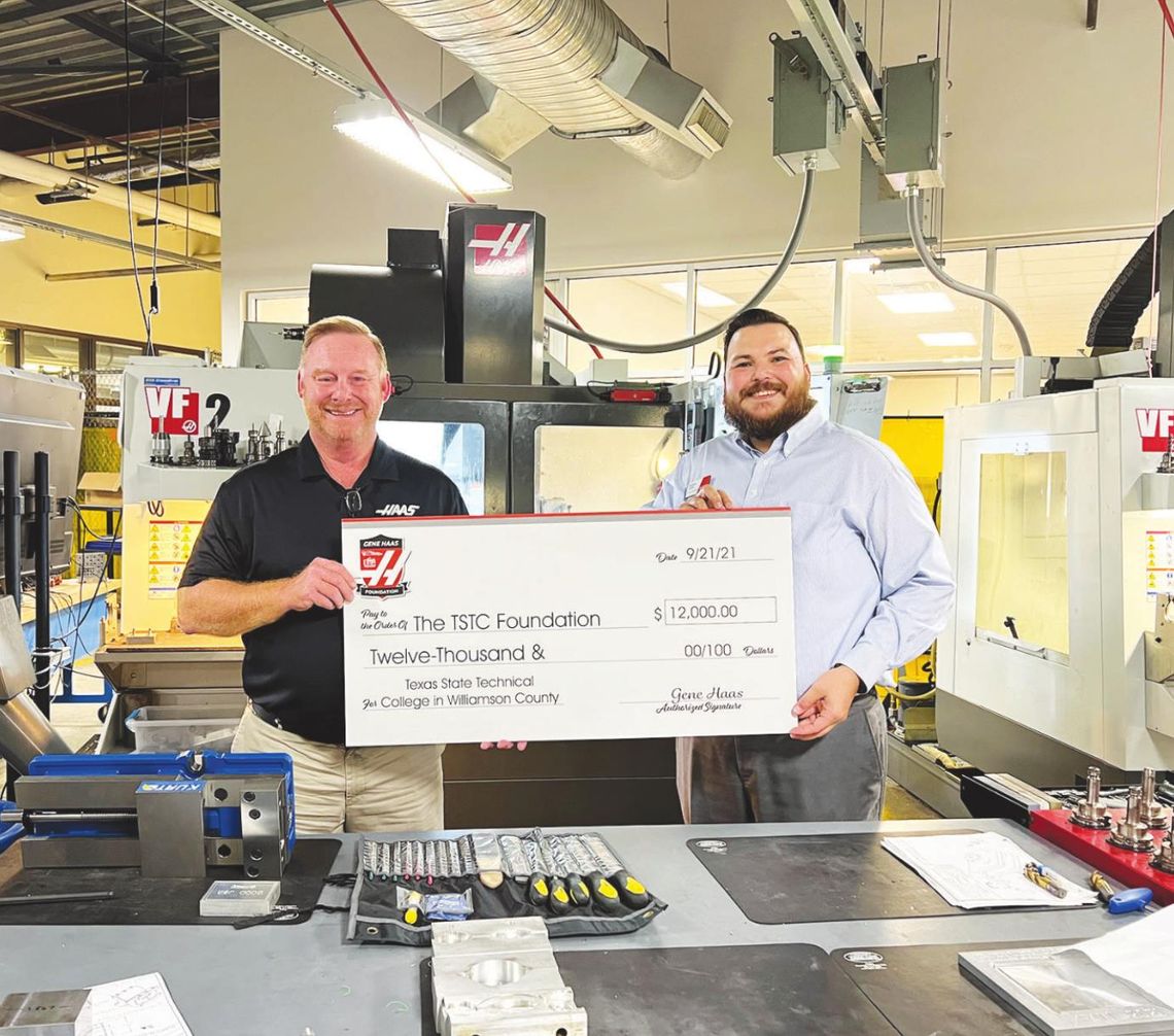 Michael Smith, The TSTC Foundation’s vice president of development, right, accepts a check for $12,000 from a Haas Foundation representative recently at TSTC’s campus in East Williamson County. Photo courtesy of TSTC