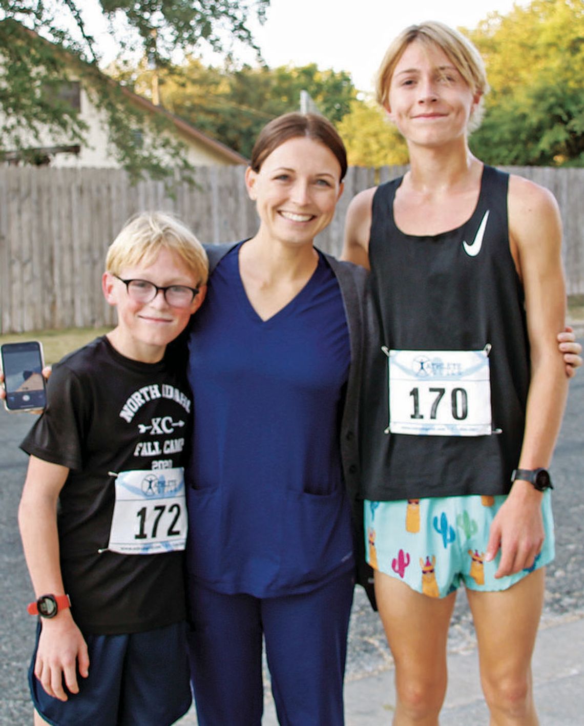 (From left) First-place winner Kingston Wilson, 13, with mom Joann Wilson, and second-place winner Keegan Wilson, 14, at the race.