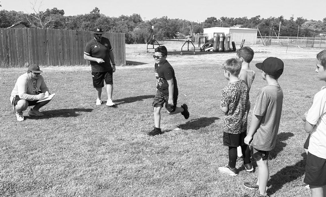 Lions youth football players run an agility drill on July 25 during the first day of the annual football camp held in Granger. Photos courtesy Granger ISD