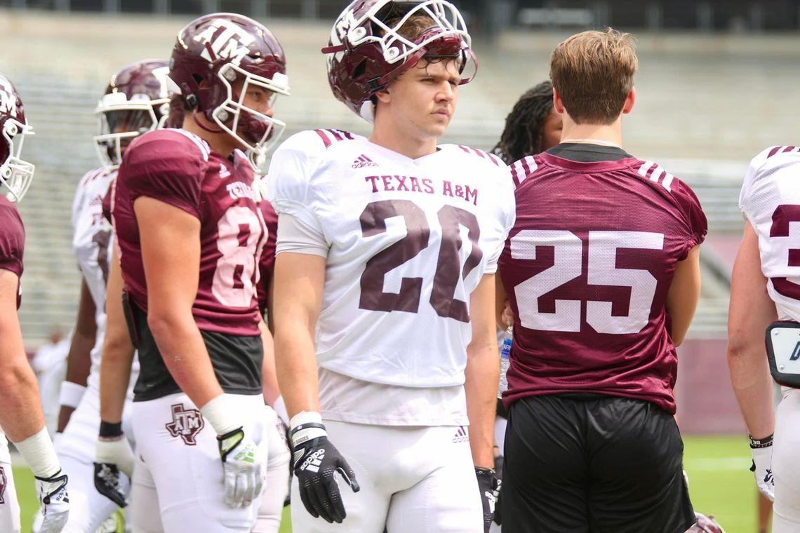 Johnny Ryder watching the drill, waiting his turn while living his dream in an Aggie uniform. 