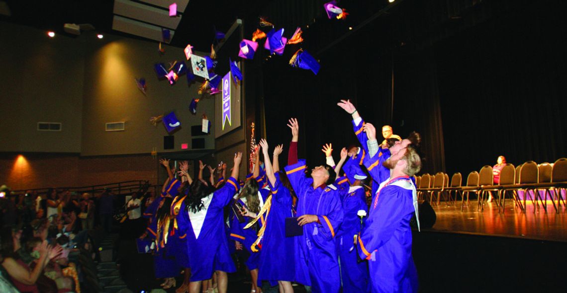 Granger High School students toss their caps in the air in celebration for their Class of 2023 Commencement Ceremony Saturday, May 27, at Taylor ISD Event Center. Photos by Grace Horvath