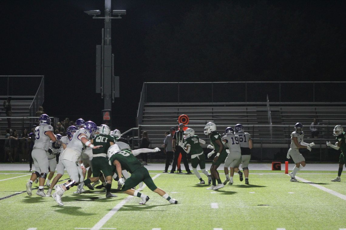 Ducks' defensive line fires off the ball looking to get past the Boerne offensive line to make a play. Photo by Evan Hale