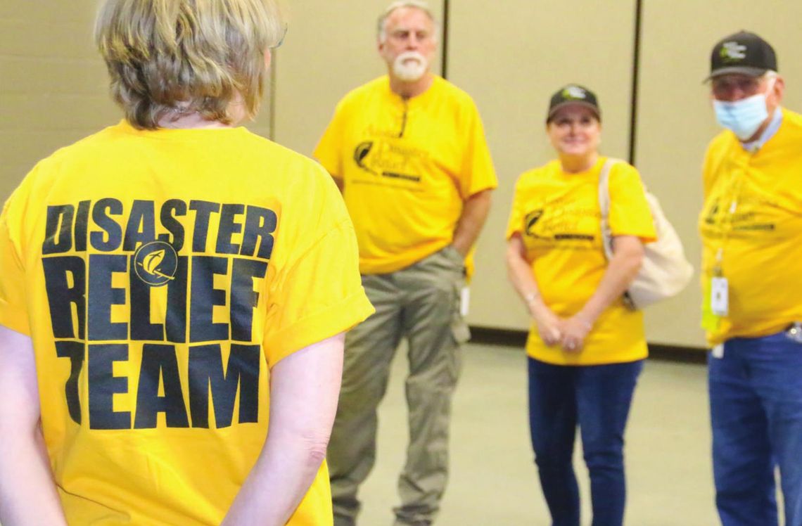 ADRN volunteers have a brief meeting and discuss how to help serve the needs of residents who have been impacted by last week’s storms.