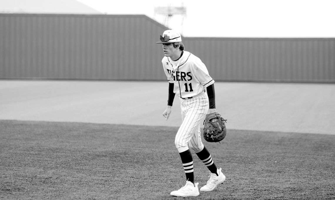 Carson Ball moving around to help his team make a defensive play as the ball is put in play. Photo by Larry Pelchat