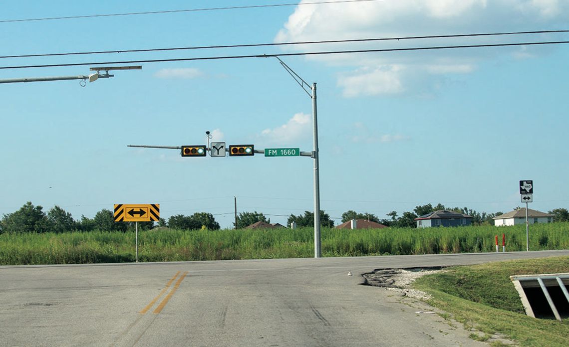 Existing three-way intersection at FM 1660 and CR 137. The field shown is slated to become a residential subdivision using CR 137 as an entrance, creating a fourway intersection. Photo by Edie Zuvanich