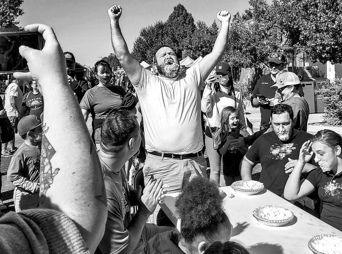 Contestants dive into pies face first to win the pie eating contest. Facebook/Hutto Chamber