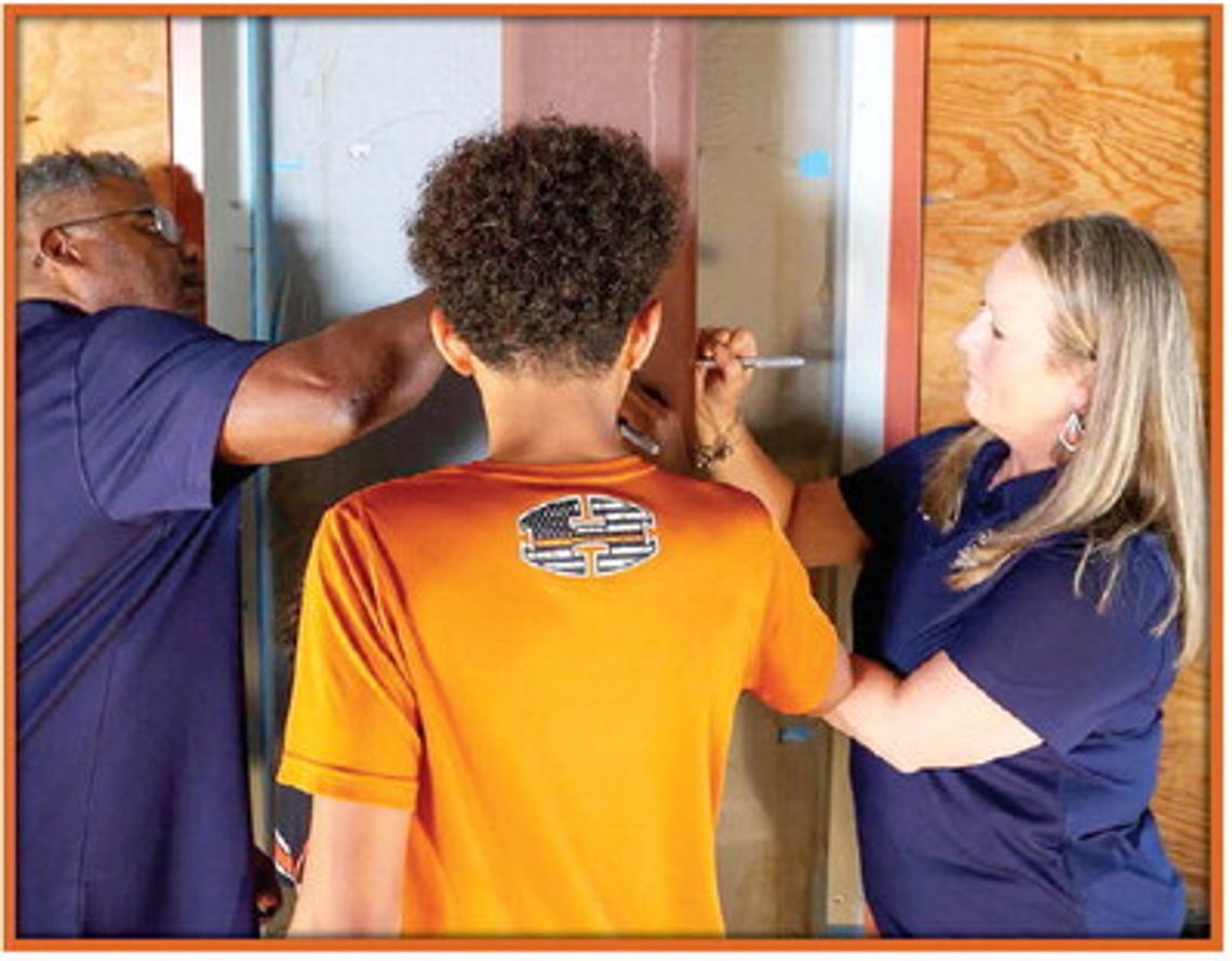 HUTTO SIGNS BEAM FOR SECOND HIGH SCHOOL