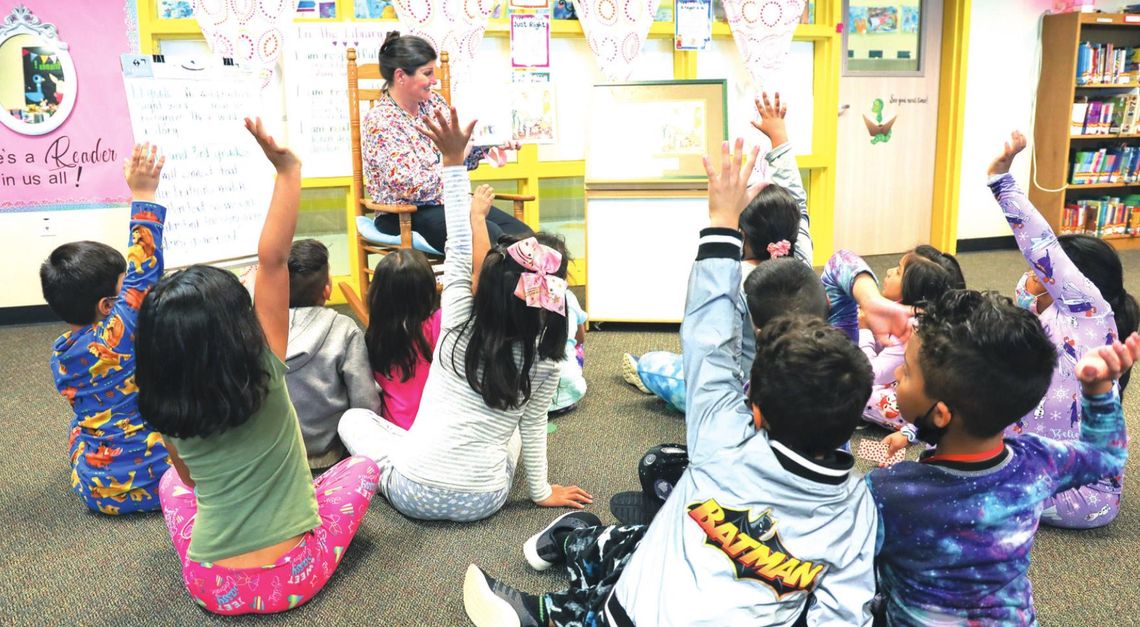 Students in Julie Snyder’s class happily listen and participate with the lesson on the book, “The Bug Cemetery.” Photos by Ryan Newsom