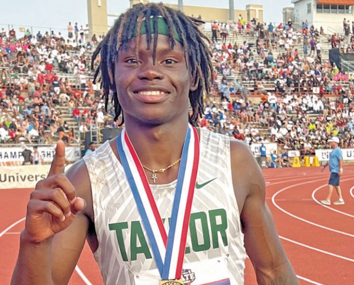 Ducks star Jarvis Anderson proudly shows off his gold medal after winning the 300-meter hurdles event on May 11 at the UIL Track and Field Championships held at Mike A. Myers Stadium in Austin. Photo by Briley Mitchell