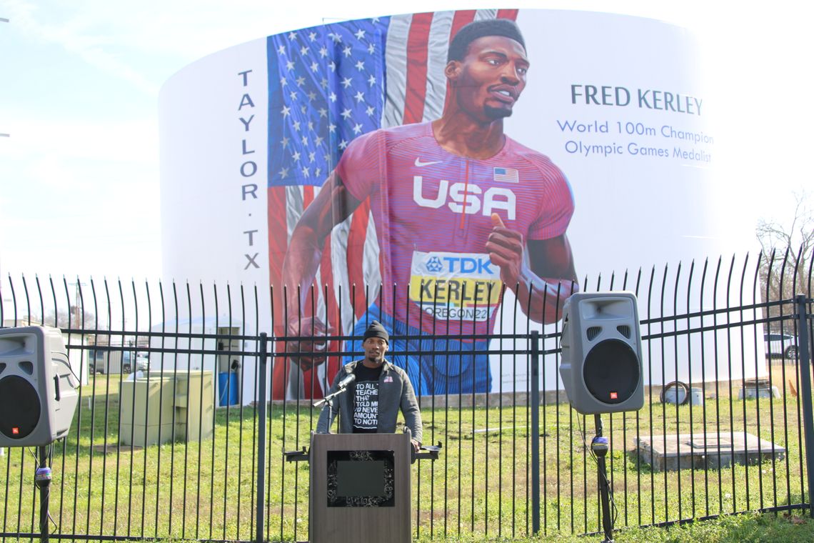 Earlier this year, Fred Kerley attended a ceremony unveiling a mural on the water tower on Main Street in Taylor. After the event, Kerley got back to work preparing for upcoming races. Photo by Jason Hennington