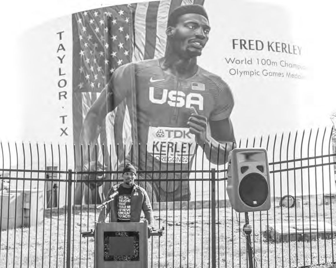 Taylor High School alumnus and Olympic medalist Fred Kerley speaks to the community on Feb. 4 at his mural dedication. Photo by Jason Hennington