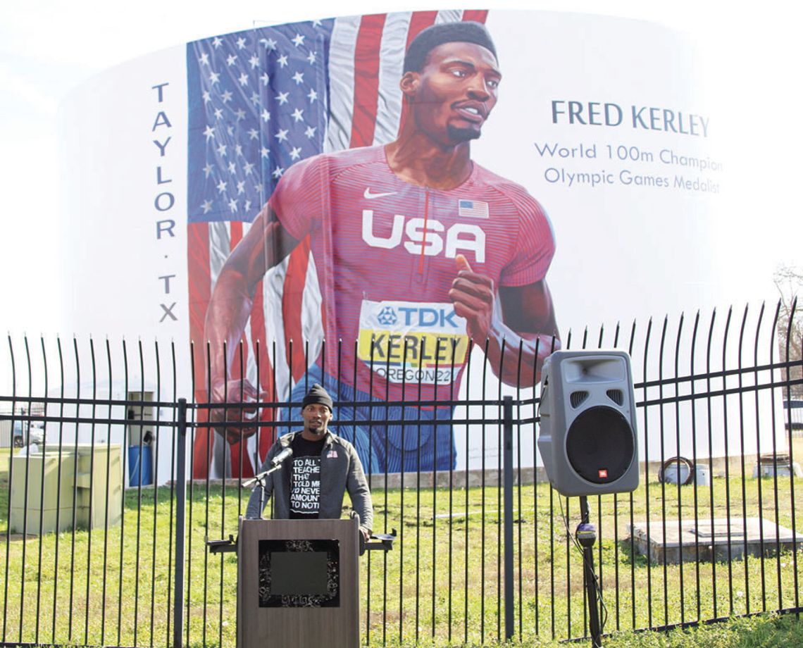 Earlier this year, Fred Kerley attended a ceremony unveiling a mural on the water tower on Main Street in Taylor. After the event, Kerley got back to work preparing for upcoming races. Photo by Jason Hennington