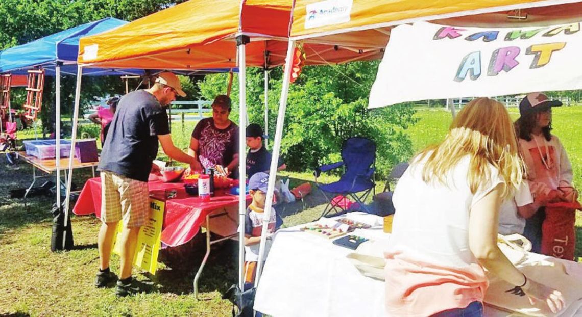 People visit booths at a previous Children’s Business Fair in Round Rock. Courtesy photo