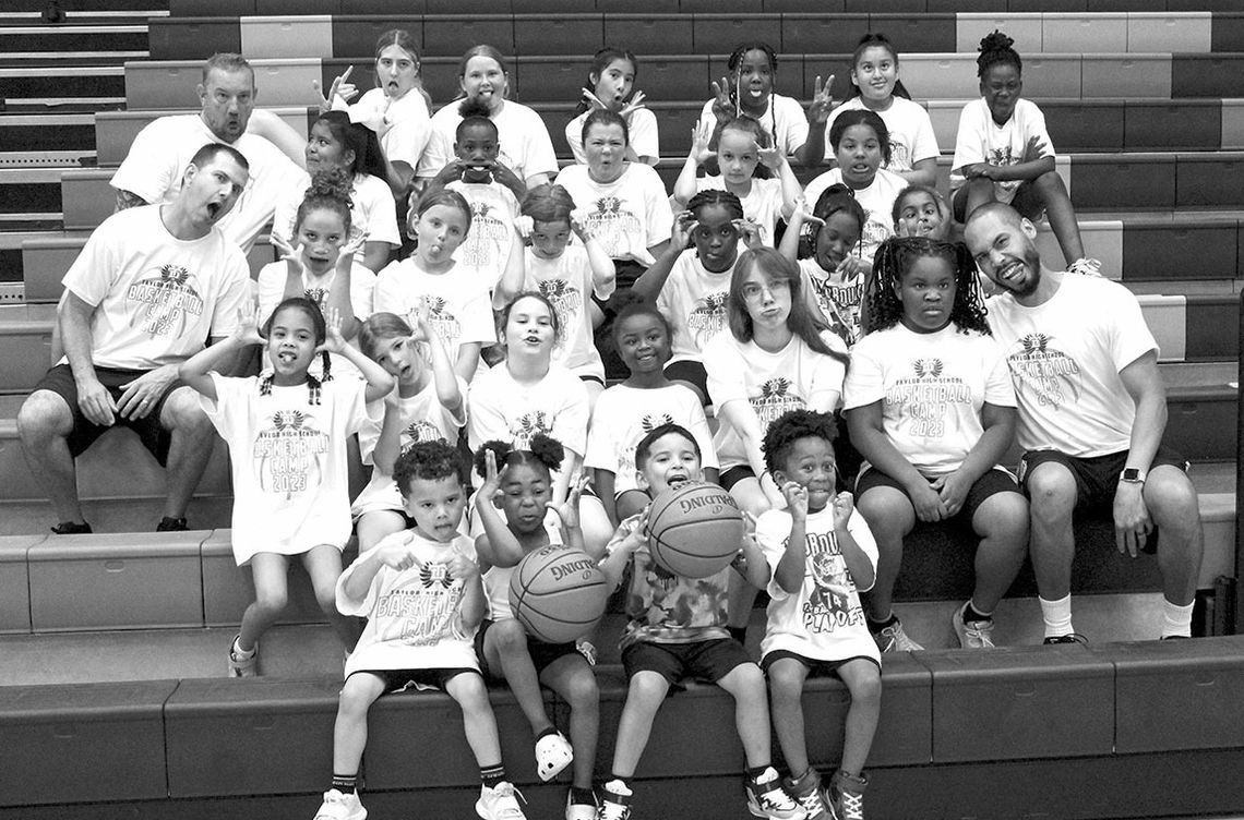 Taylor campers and coaches from grades two through five make silly faces on June 8 following the final day of Lady Ducks Youth Basketball Camp.