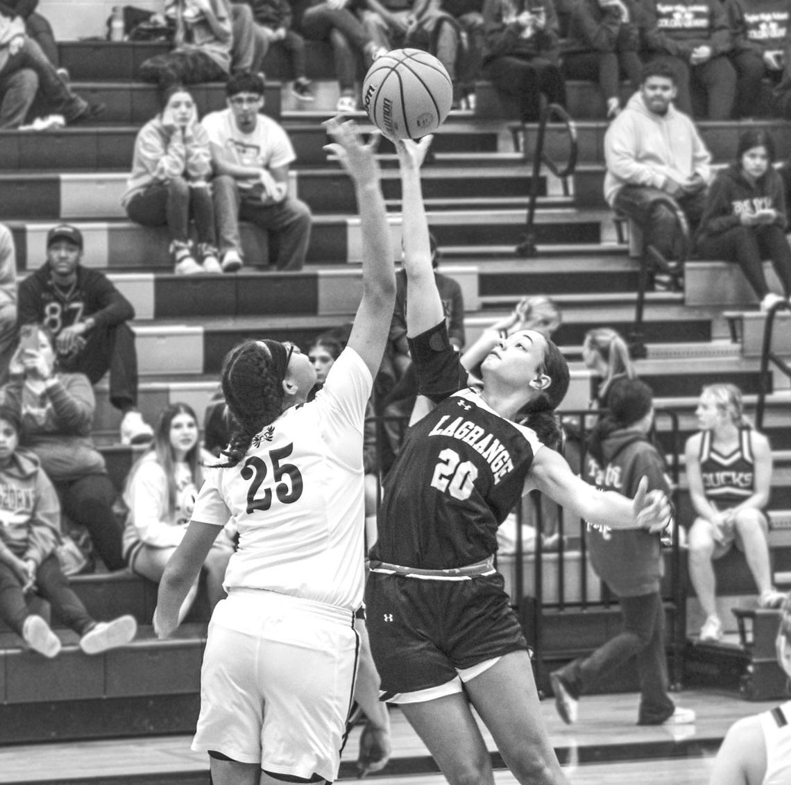 Kionayh Rivers battles for the opening tip off to start the game against La Grange. Photo By Evan Hale