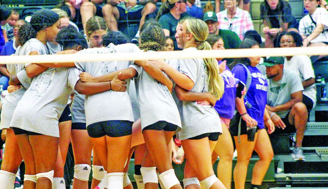 The Taylor High School varsity volleyball team huddles together on Saturday, Aug. 5 prior to the Lady Ducks’ home scrimmage against Killeen Chaparral High School. Photo by Andrew Salmi