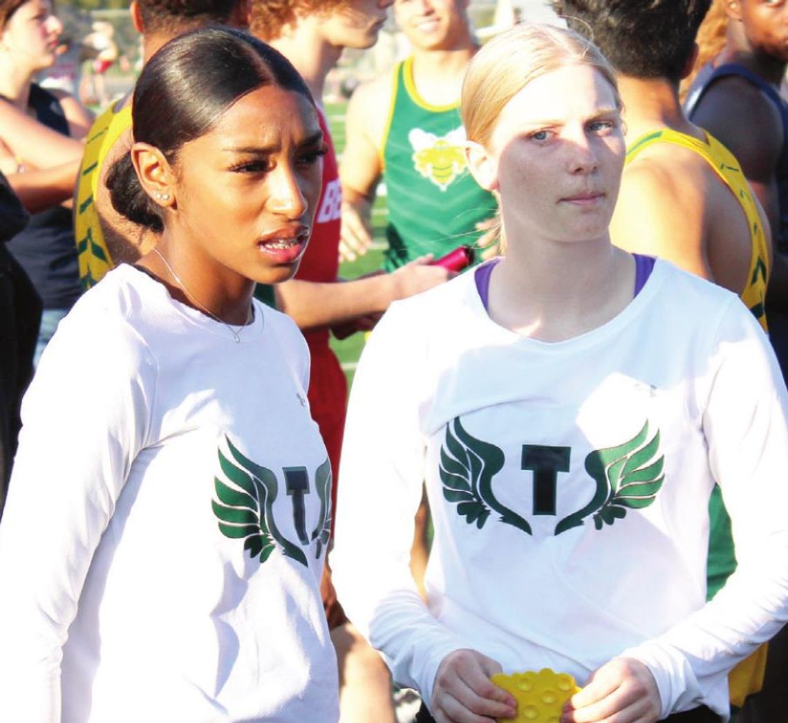 Lady Duck track speedsters Destiny Lewis and Emma Whitsel stand ready to go at the Riesel Indian Invitational last Thursday, March 17. Photo by Matt Hooks