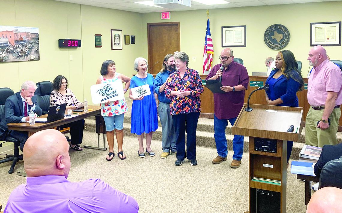 At Large Councilman Dwayne Ariola reads the mayor’s proclamation of September being “Library Card Sign-up Month” in the City of Taylor to Library Director Karen Ellis at the City Council meeting Aug. 25.