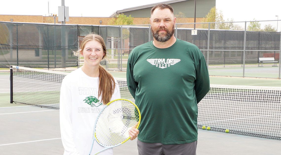 Taylor High School’s Regional Tennis Champ, Rylee Michna, and her coach, Kevin Williams, take a break during practice. Photo by Tim Crow