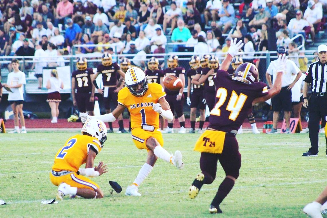 Granger High School varsity football junior kicker Jose Valverde puts the ball through the uprights on Sept. 1 during the Lions’ 38-7 victory over Thorndale High School. Photo by Elliot Bohuslav