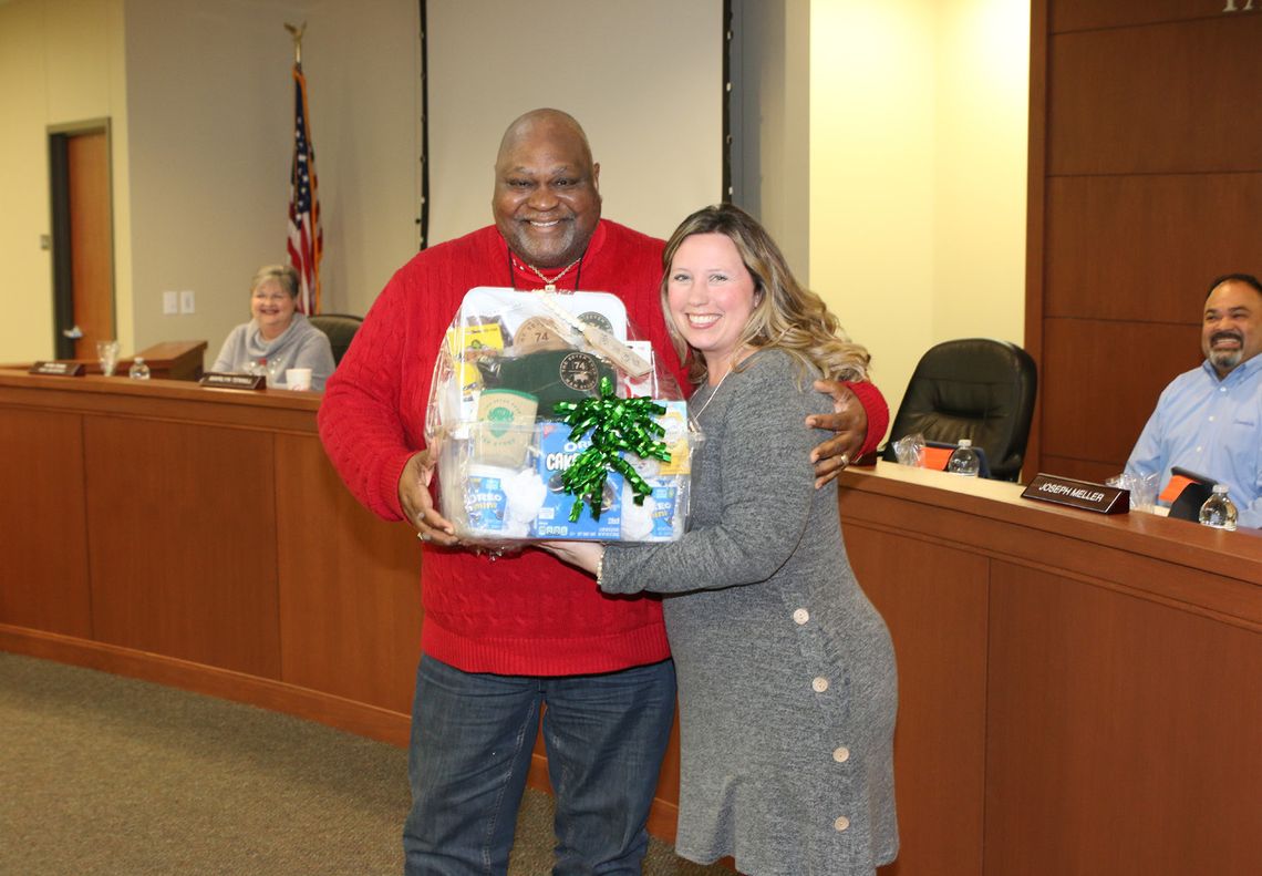 Main Street Intermediate School Principal, Kerri Pierce, presents a gift basket of appreciation to Taylor ISD School Board Member, Shorty Mitchell. Photos by Tim Crow