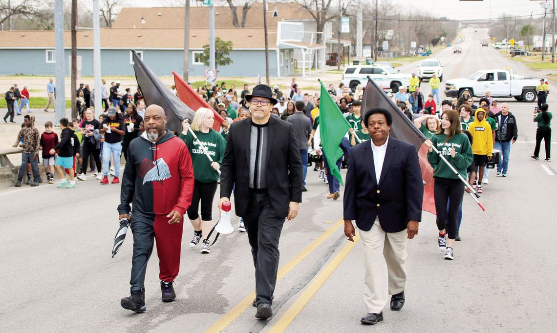 Led by (from left) Rev. Brian Coleman, Rev. Anthony Watson and Rev. Carl Caldwell, the Martin Luther King Jr. march proceeds over the Main Street overpass. Photo by Jason Hennington