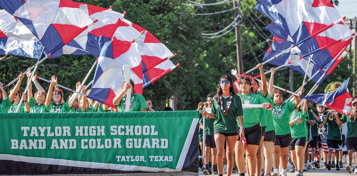 Members of the Taylor High School band and color guard marched and performed during the Fourth of July parade Thursday morning