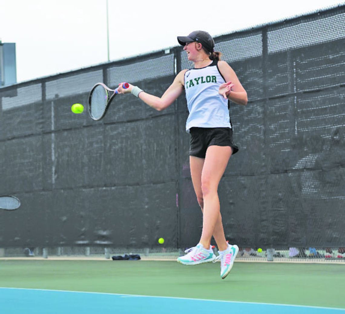 Lady Duck freshman tennis player Rylee Michna strikes the ball on her way to a state championship. Photo by Krista Randig