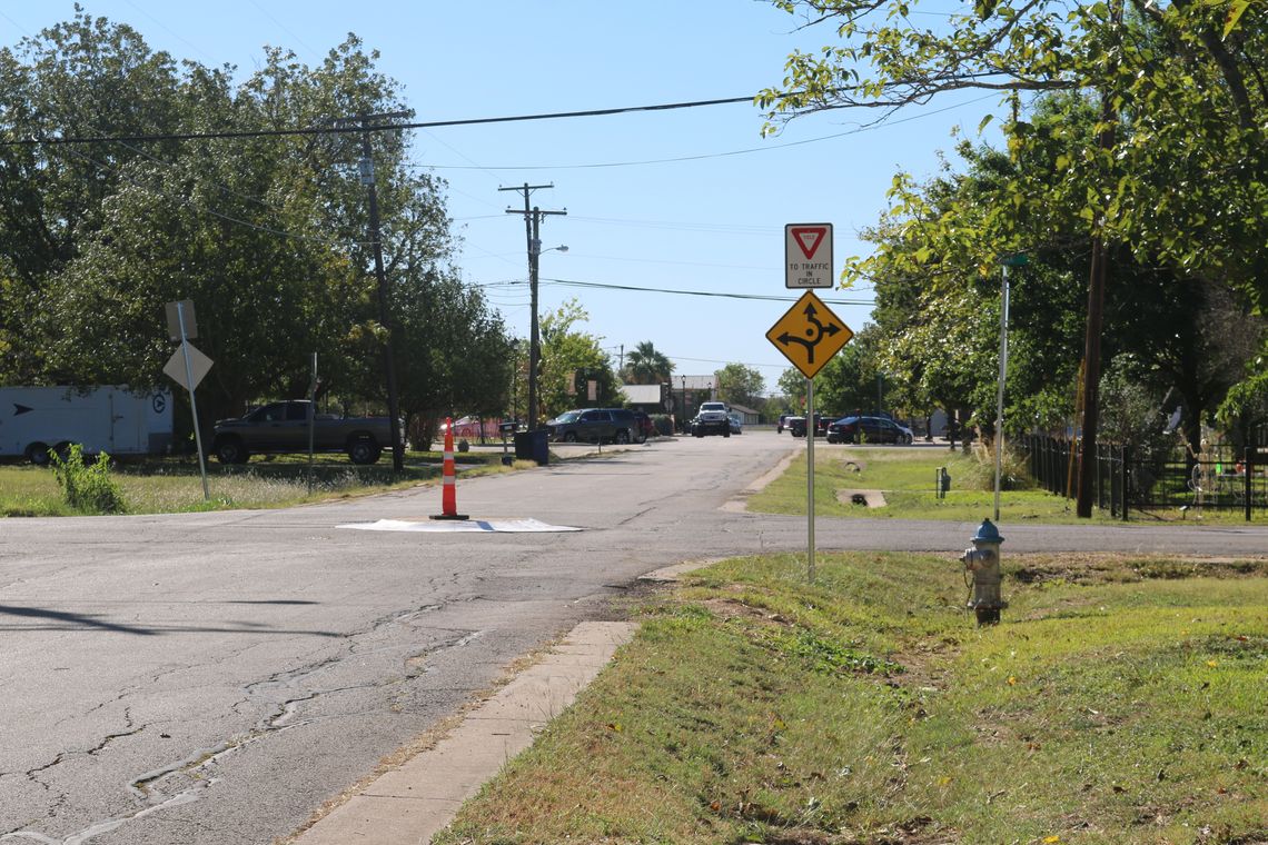 The mini traffic calming circles should be treated more as an obstacle than a roundabout. Drivers should slow down and proceed in the same way they would if it were a large box in the road. Photo by Edie Zuvanich