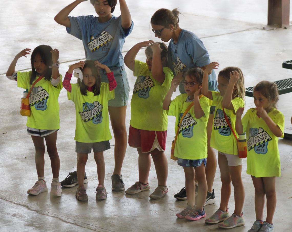 Estanna de Senna, Willow Fox, Gigi Bond, Olivia Gamboa, Sofia Outlaw and Olivia Arnold perform a skit this past Friday, June 17 as counselors Stella Fitzpatrick and Greta Hutmacher help coordinate.