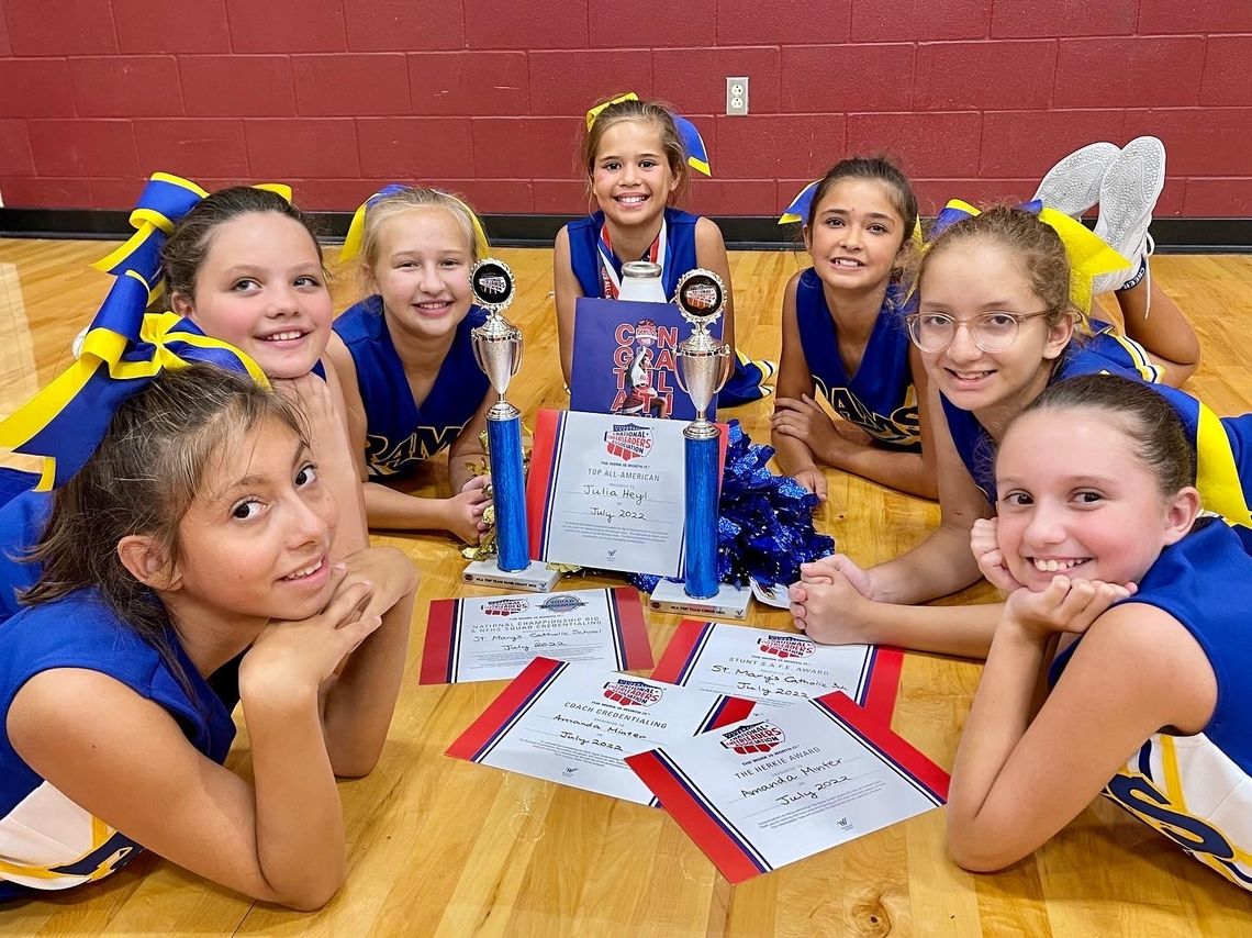 St. Mary’s Catholic School cheerleaders celebrate awards from the National Cheerleaders Association summer day cheer camp in July. Courtesy photos