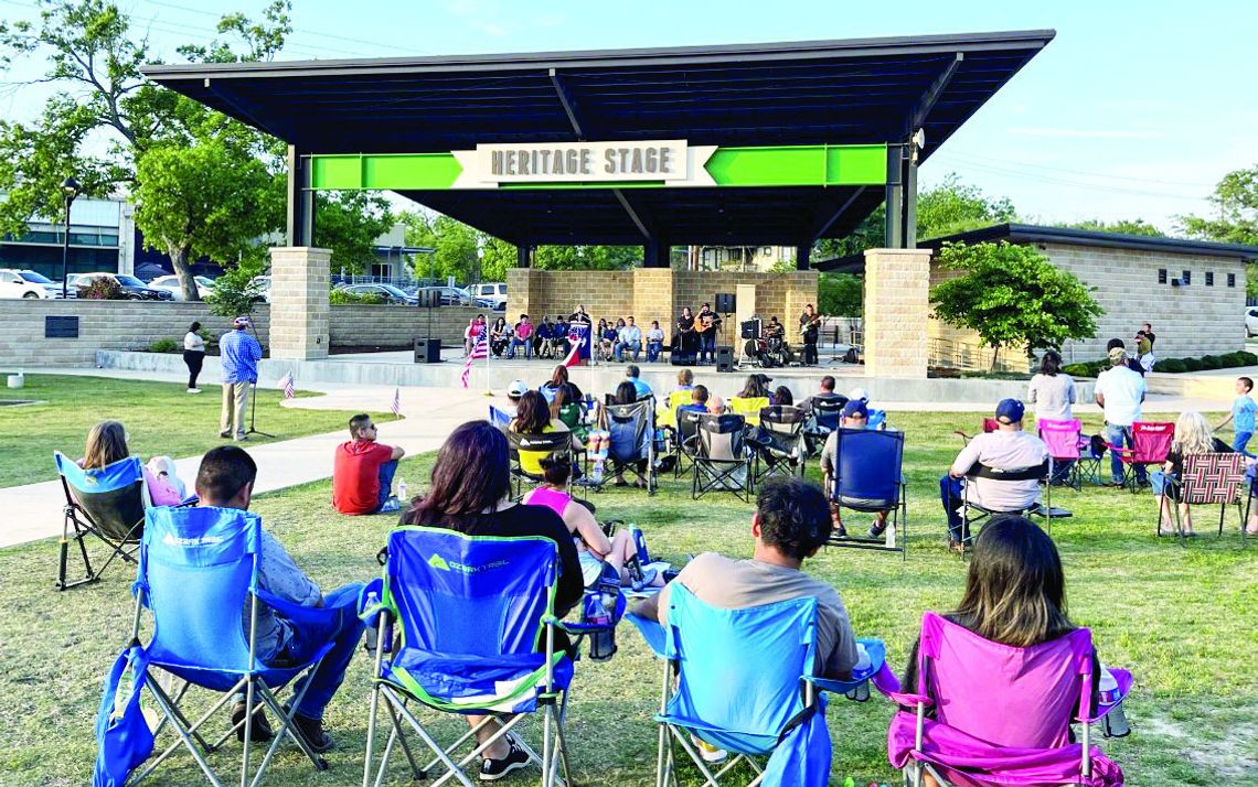 Oasis Church Pastor Mary Flores speaks over the crowd at Heritage square for a community honoring of the National Day of Prayer May 4. Photos by Grace Horvath