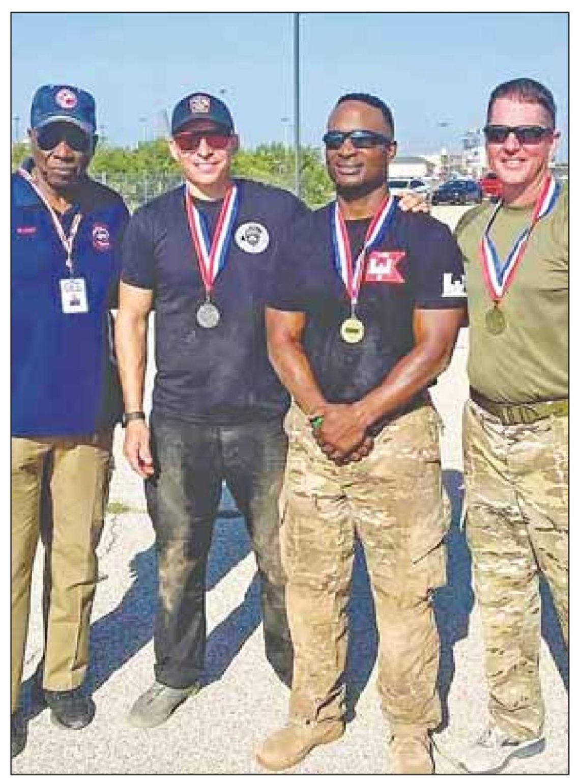 Officer Randy Wheeler (second from left, is pictured with other competitors at the Texas Police Games in San Angelo June 13. Facebook / Hutto Police Department