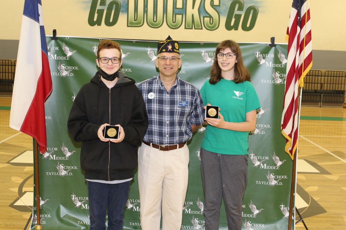 Mason Ruemke (left) and Elinor Brinkmeyer receive the American Legion Award at Taylor Middle School in Taylor May 26. Photo by Tim Crow