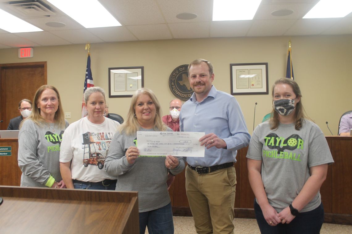 Members of the Taylor Pickleball group present a check to Taylor municipal government through Tyler Bybee, Taylor Parks and Recreation director, during the Jan. 13 City Council meeting. Pictured are (from left) Cathy Warner, Sheila Pausewang, Brenda Cox, Bybee and Lynsie Patschke. Photos b...