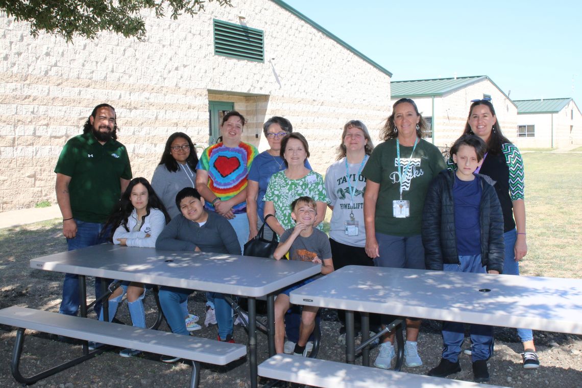 Cheryl Mazur and Barbara Sladek of the Taylor Garden Club present two picnic tables to Kindra Wimberley and her class at Taylor Middle School. Also present for the presentation are principal Steven Vigil and instructional assistants Theresa Randig and Andrea Razo. Students will enjoy the t...