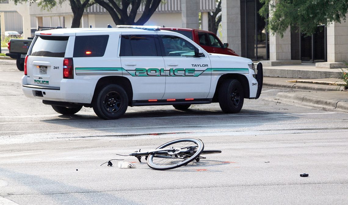 Police: Cyclist struck, dragged by car