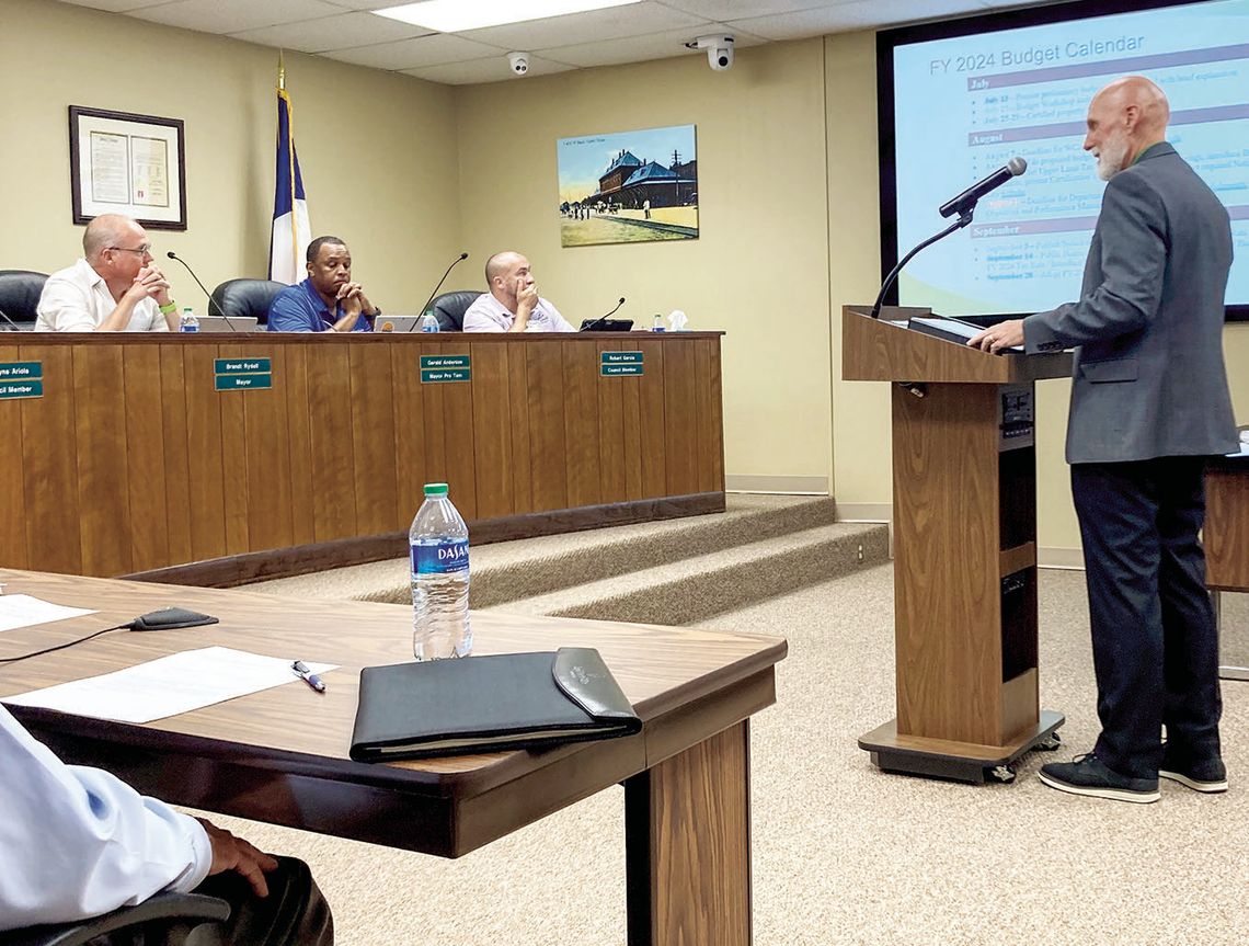 Taylor’s Chief Financial Officer Jeffrey Wood gives a preliminary presentation of next year’s budget to the City Council at the July 13 meeting. Photo by Nicole Lessin