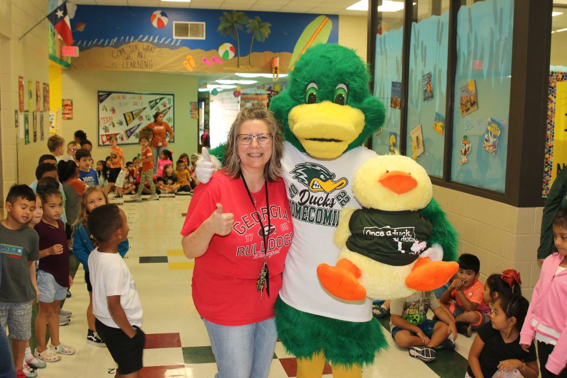 T. H. Johnson’s library mascot, Quackers, recently met his hero, Taylor High School mascot, Waddles. The meeting was arranged by THJ librarian, Brenda McNulty. Courtesy photo by Tim Crow