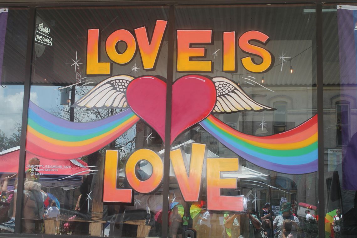 A window in downtown Taylor displays “Love is Love” during the Taylor Pride event June 26, 2021. Photo by Fernando Castro